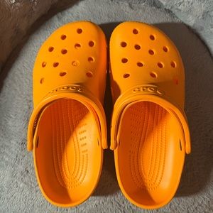 gently used crocs in orange